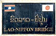 Sign of the  Lao-Nippon Bridge in Pakse by Asienreisender